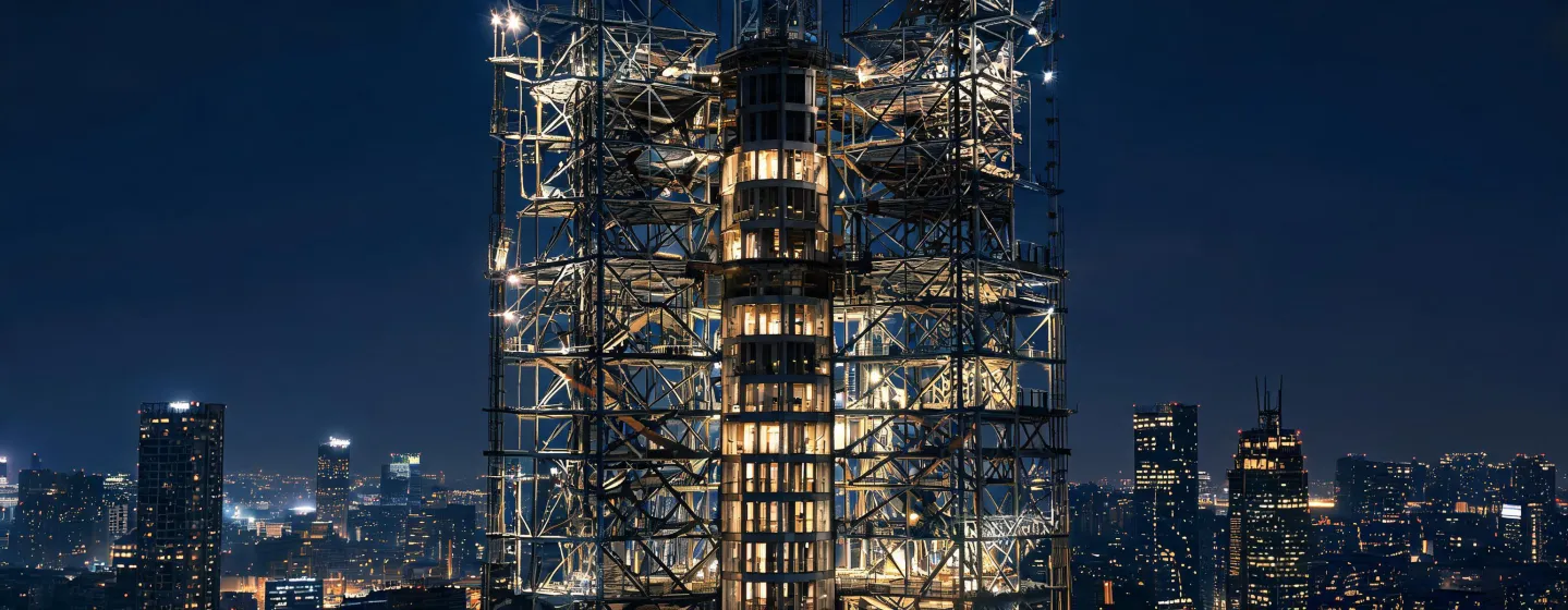 Night view of illuminated commercial tower steel frame